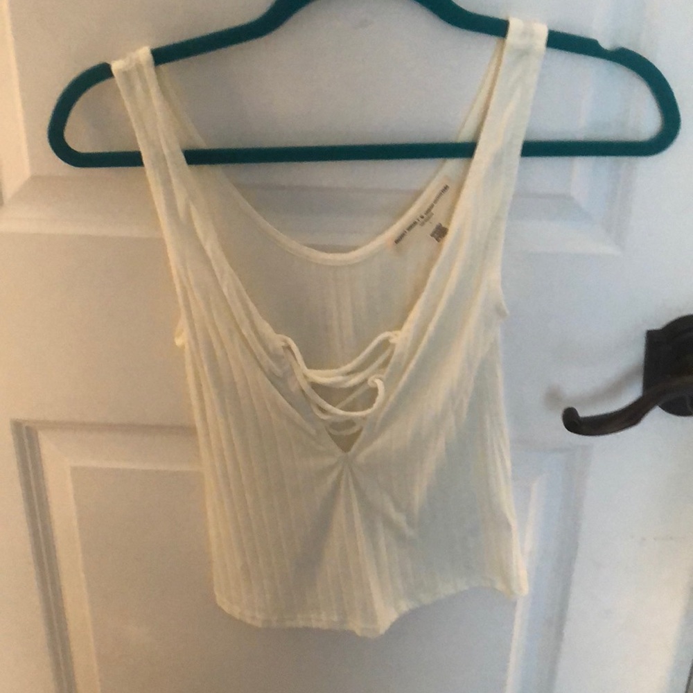 Cream Tank top with Hockey lace.
